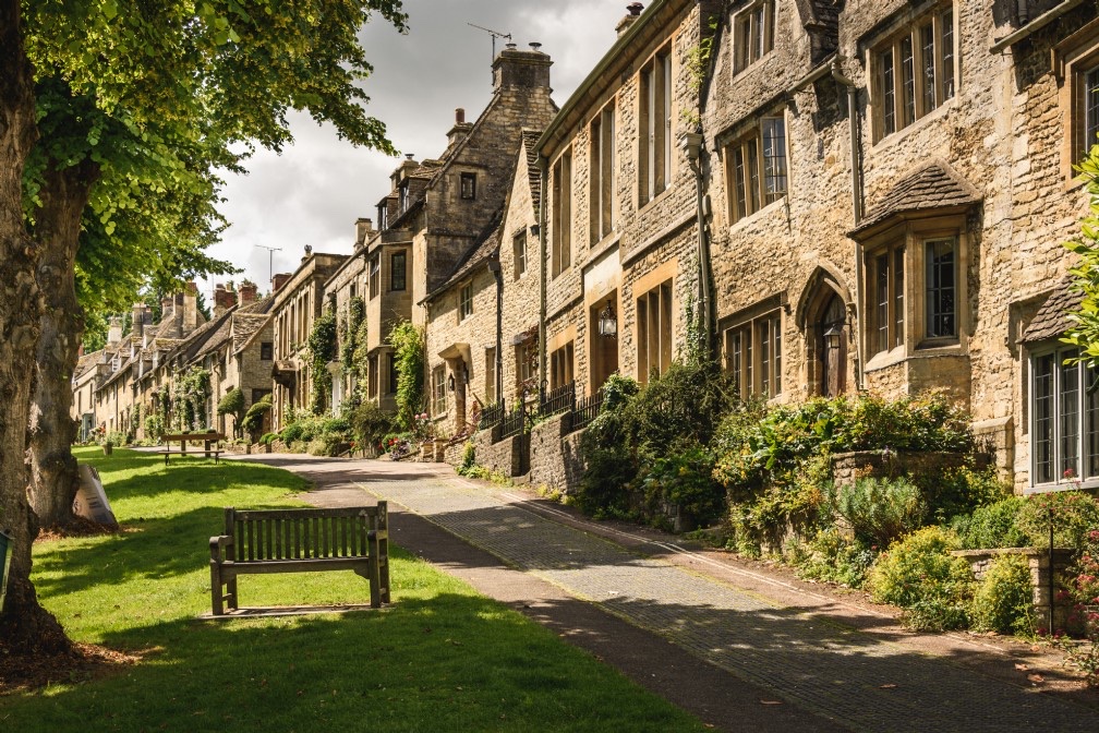 The hill into town. Hill, church, Windrush. A proper Cotswold threshold.
